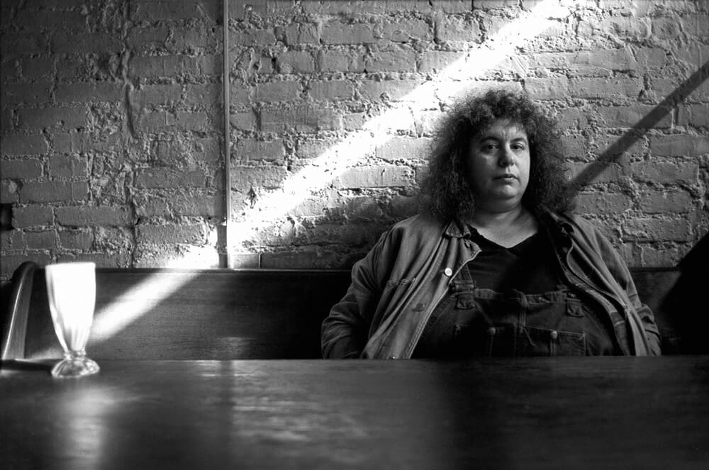 A black and white photo of Andrea Dworkin